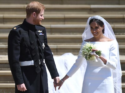 epa06749781 Britain's Prince Harry (L), Duke of Sussex and Meghan (R), Duchess of Sussex exit St George's Chapel in Windsor Castle after their royal wedding ceremony, in Windsor, Britain, 19 May 2018. The couple have been bestowed the royal titles of Duke and Duchess of Sussex on them by the British monarch.  EPA/NEIL HALL / POOL