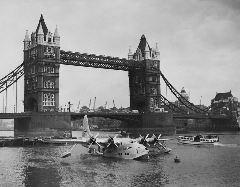 The British Overseas Airways Corporation Short Solent passenger flying boat docks at her new berth near Tower Bridge in London in 1949