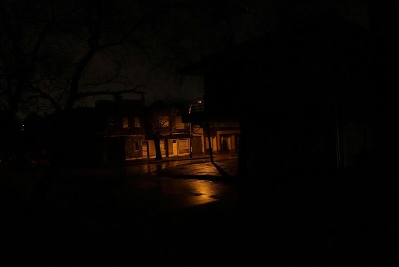 A lamppost shines down a street as the rest of the neighbourhood Parque Batlle goes without electricity.   Reuters