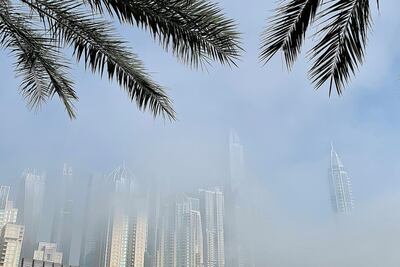 DUBAI, UNITED ARAB EMIRATES , April 08 – 2020 :- View of the towers in Dubai Marina during the early morning fog in Dubai. Dubai is conducting 24 hours sterilisation programme across all areas and communities in the Emirate and told residents to stay at home. UAE government told residents to wear face mask and gloves all the times outside the home whether they are showing symptoms of Covid-19 or not. (Pawan Singh/The National) For News/Online/Instagram/Standalone