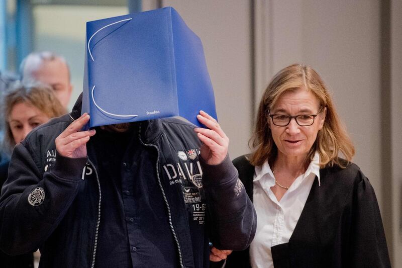 Former nurse Niels Hoegel, accused of killing more than 200 patients in his care, arrives with his lawyer Ulrike Baumann, in court. AFP