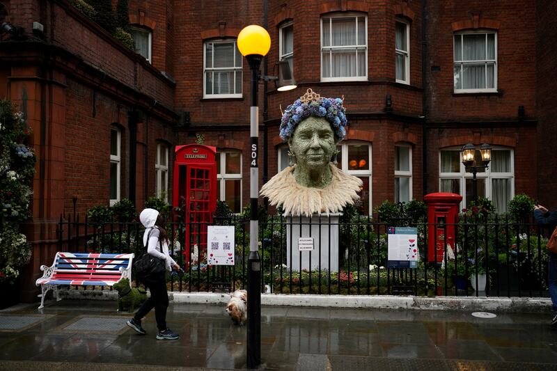 A display paying homage to Queen Elizabeth II is shown outside the Sloane Club in London, as part of 'Chelsea in Bloom'. AP 