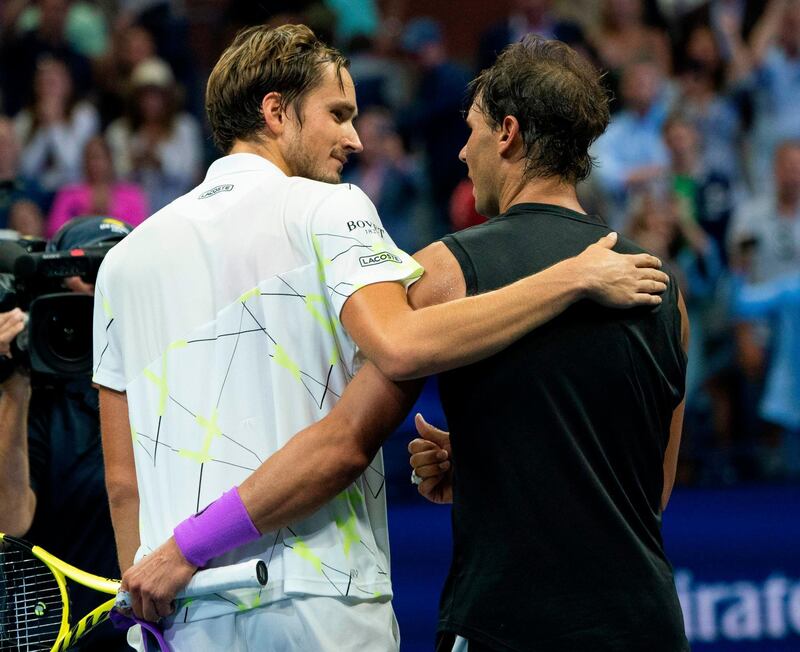Daniil Medvedev, left, and Rafael Nadal  embrace after the US Open final at Flushing Meadows in New York. Nadal captured his 19th career grand slam title in thrilling fashion on Sunday by beating Medvedev 7-5, 6-3, 5-7, 4-6, 6-4. AFP