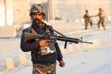 An Afghan National Army soldier keeps watch near the site of a blast in Jalalabad, Afghanistan February 11, 2021. Reuters