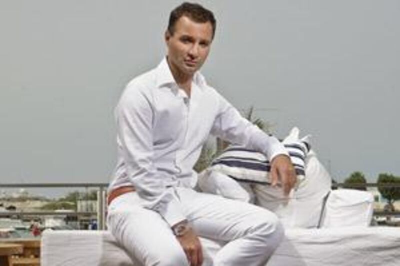 Aseef Vaza, ,an accessories designer, poses for a portrait at the Yacht Club in Abu Dhabi.