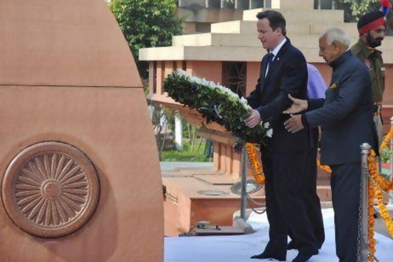 David Cameron, the British prime minister, places a wreath at the Jallianwala Bagh memorial in Amritsar on Wedneday. Munish Sharma / Reuters