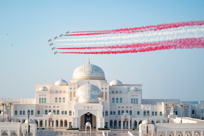 Al Forsan aerobatic team mark the visit with a colourful flypast.