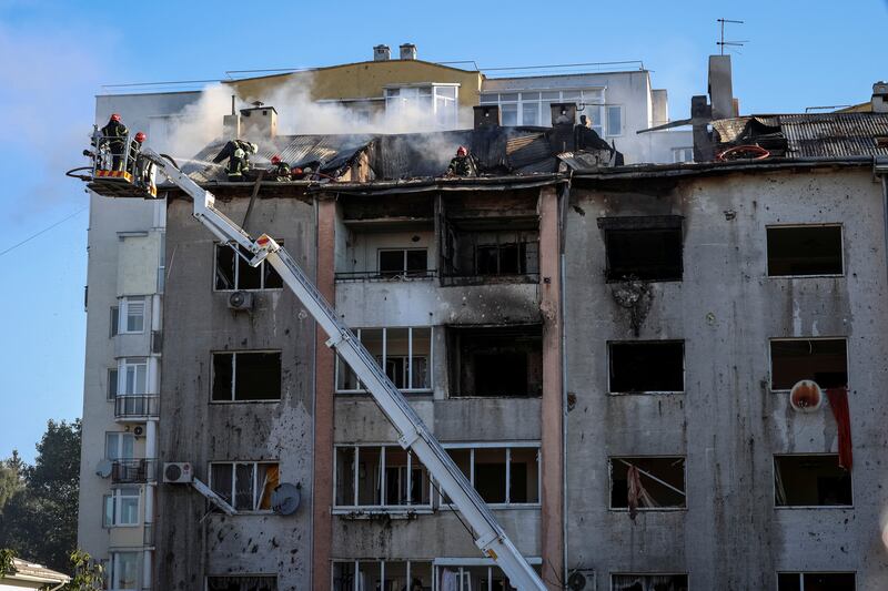 First responders work at the site of a block of flats destroyed by a Russian missile strike in Lviv. Reuters