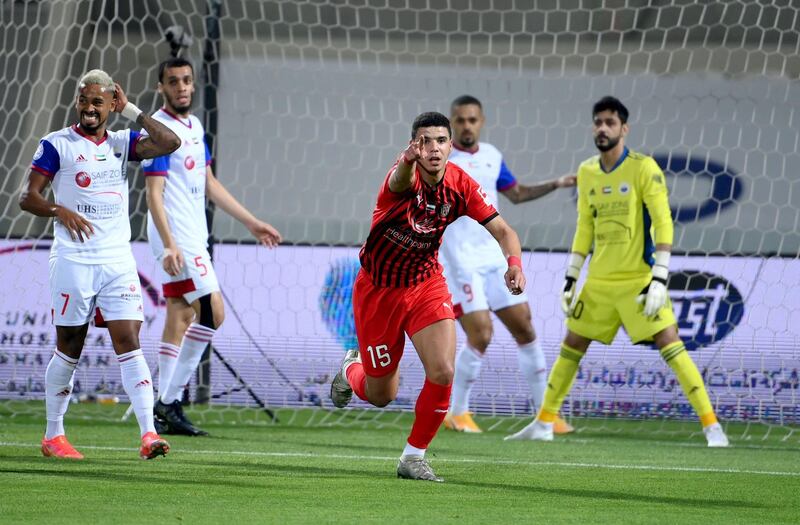 Al Jazira’s Mohammed Rabie reacts after scoring the opening goal with Caio (No.7) on left in the Arabian Gulf League top of the table clash at Sharjah stadium on Friday, February 26, 2021. Courtesy PLC