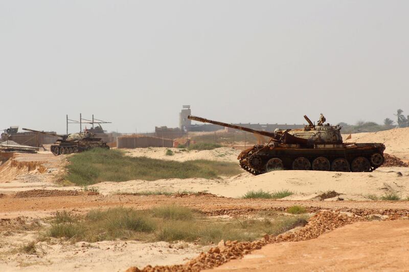 Yemeni pro-government forces tanks are positioned near Mukalla airport. AFP