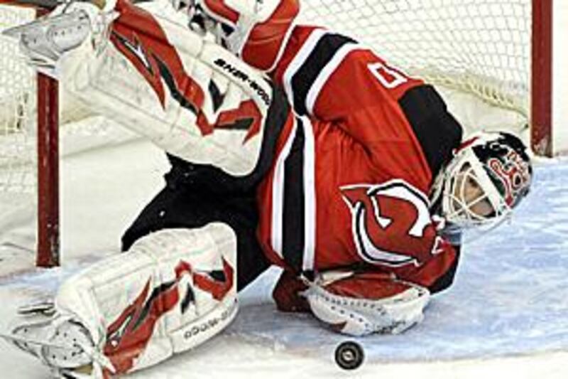 Martin Brodeur makes a save against the Flyers.