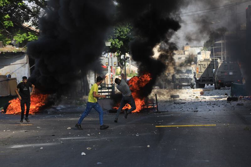 Palestinians clash with Israeli troops. EPA