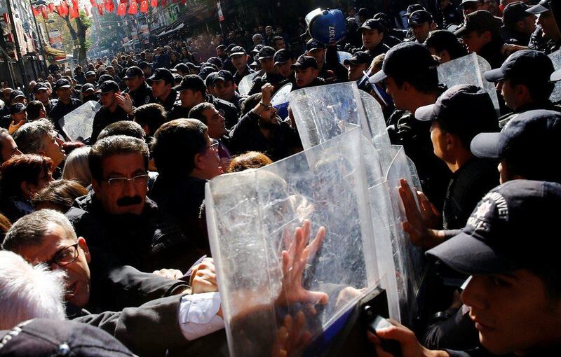 Demonstrators scuffle with riot police during a protest against the arrest of pro-Kurdish Peoples’ Democratic Party lawmakers, in Ankara, Turkey. Umit Bektas / Reuters