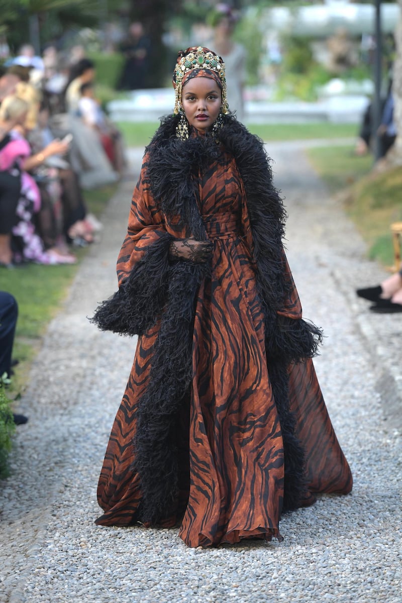 <p>Halima Aden wore a voluminous kaftan with a matching head wrap. Courtesy Dolce &amp; Gabbana</p>
