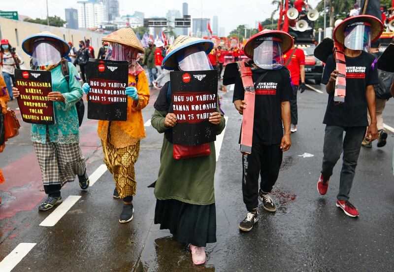 Farmers in Jakarta protest outside the Indonesian parliament against cancellation of an 'omnibus bill' that seeks to revise dozens of existing laws to allow investment into South-East Asia's largest economy. Reuters