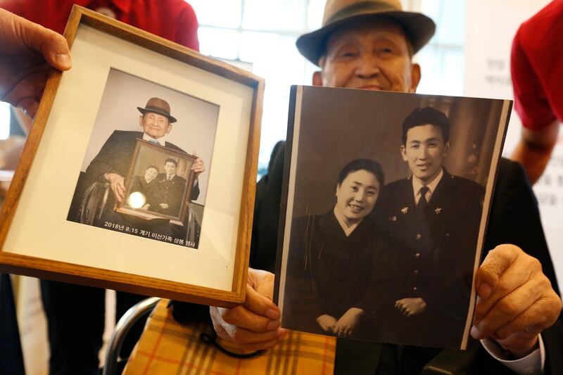 A South Korean separated family member holds a his family pictures to give his North Korean family at Hanwha resort on Sokcho in Gangwon-do, South Korea. EPA