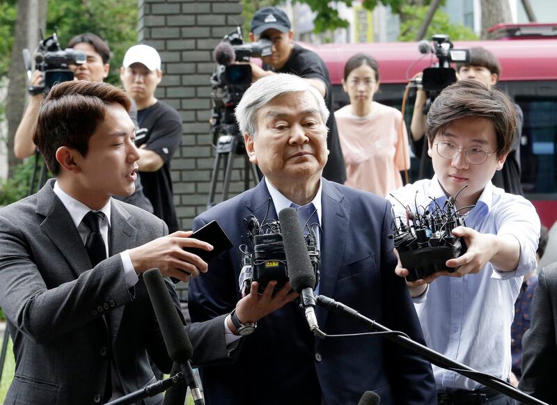 FILE - In this June 28, 2018 file photo, Cho Yang-ho, center, the chairman of Korean Air Lines Co., arrives for an investigation over allegations of embezzlement at the Seoul Southern District Prosecutors' Office in Seoul, South Korea. Korean Air says on Monday, April 8, 2019, its chairman, Cho Yang-ho, has died in the United States because of an unspecified illness. (AP Photo/Ahn Young-joon, File)