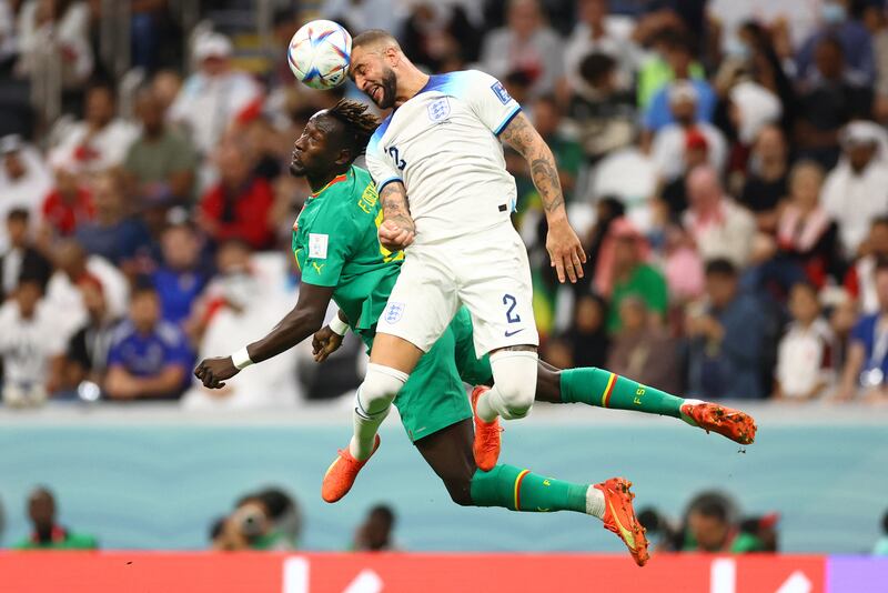 Senegal's Famara Diedhiou in action with England's Kyle Walker. Reuters