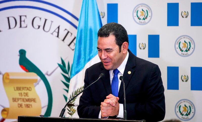 Guatemalan President Jimmy Morales speaks during the inauguration ceremony of the inauguration ceremony of Guatemala's embassy in Jerusalem on May 16, 2018.
 Guatemala inaugurated its Israel embassy in Jerusalem on May 15, becoming the first country to follow in the footsteps of the United States' deeply controversial move, breaking with decades of international consensus. / AFP / POOL / RONEN ZVULUN
