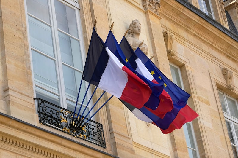 The French and European flags flying from the Elysee Palace in Paris. AP