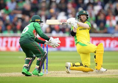 NOTTINGHAM, ENGLAND - JUNE 20:  David Warner of Australia in action batting as Mushfiqur Rahim of Bangladesh looks on during the Group Stage match of the ICC Cricket World Cup 2019 between Australia and Bangladesh at Trent Bridge on June 20, 2019 in Nottingham, England. (Photo by Clive Mason/Getty Images)