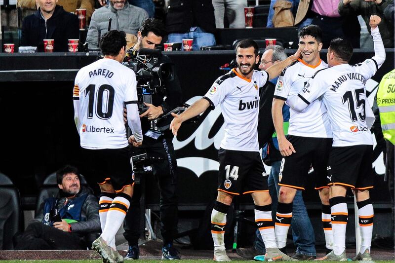 Valencia's Carlos Soler (2-R) celebrates with teammates after his goal.  EPA