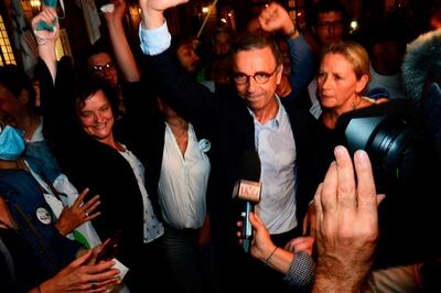 French ecologist party Europe Ecologie - Les Verts (EELV) candidate for Bordeaux mayor Pierre Hurmic (C) arrives at the City Hall, following his victory after the second round of the French municipal elections in Bordeaux on June 28, 2020.   / AFP / MEHDI FEDOUACH
