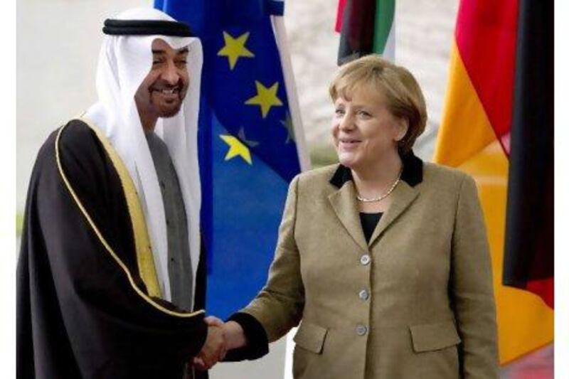 The German chancellor, Angela Merkel, greets Sheikh Mohammed bin Zayed, Crown Prince of Abu Dhabi, on his arrival in Berlin yesterday.