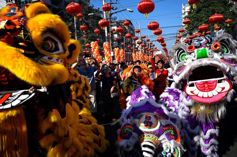 Lion dancers perform during celebrations in Yangon, Myanmar. AFP