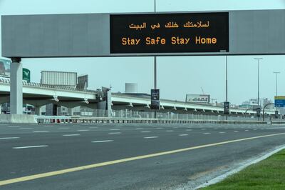 DUBAI, UNITED ARAB EMIRATES. 10 APRIL 2020. A sign on Sheikh Zayed rd warns motorists to stay home during the COVID-19 Lockdown of Dubai. (Photo: Antonie Robertson/The National) Journalist: Standalone. Section: National.