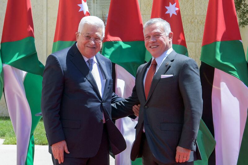 Palestinian President Mahmoud Abbas is received by Jordan’s King Abdullah in Amman on Sunday. AFP