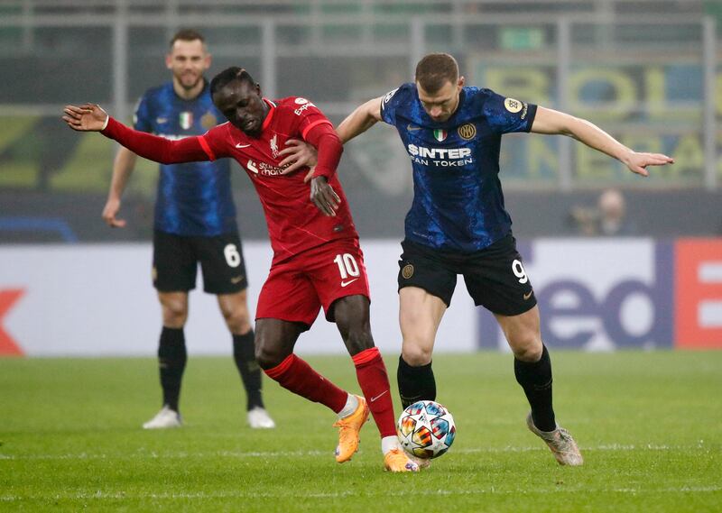 Liverpool's Sadio Mane battles with Inter Milan's Edin Dzeko. Reuters