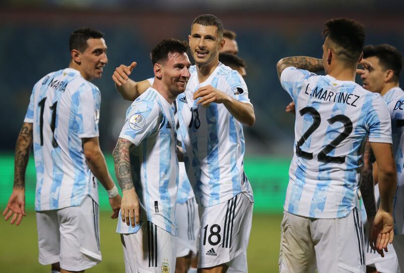 Lionel Messi celebrates scoring their third goal.