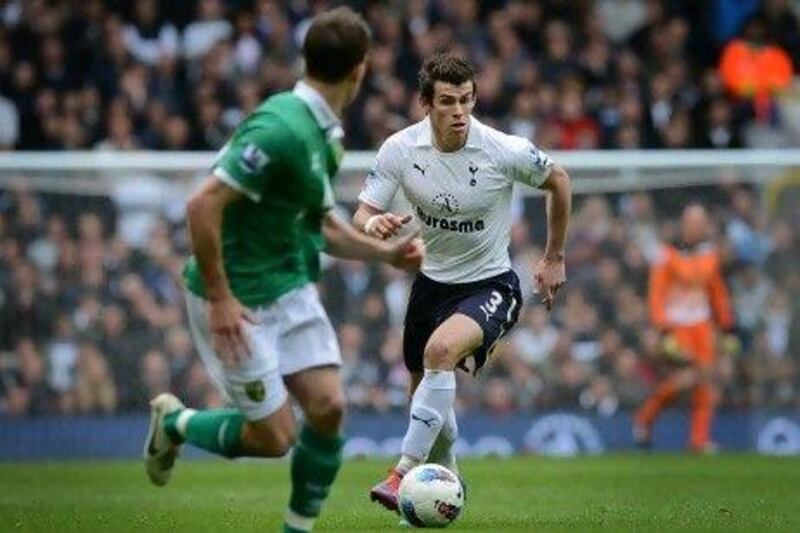 Welsh midfielder Gareth Bale, right, is rumoured to be on Barcelona's radar, but Tottenham Hotspur manager Harry Redknapp says Bale is happy with the Spurs.