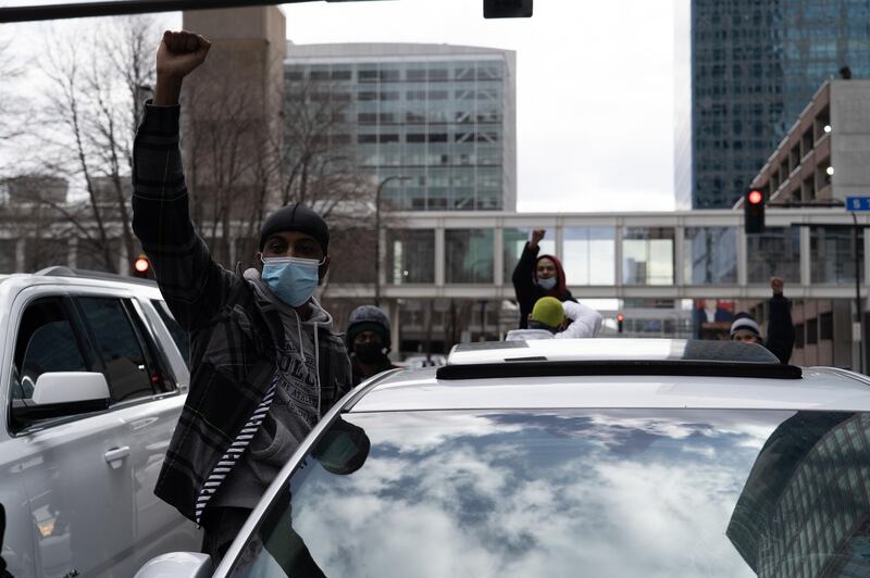 A man pumps his fist from out his car window after former police officer Derek Chauvin was found guilty of 3 counts in the death of George Floyd. Willy Lowry / The National