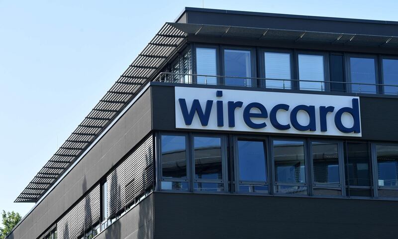 (FILES) In this file photo taken on June 24, 2020 the company logo is seen at the headquarters of German payments provider Wirecard in Aschheim near Munich, southern Germany.  Germany's finance and economy ministers will be grilled by lawmakers on July 29, 2020 about the massive fraud scandal that brought down payments provider Wirecard, amid criticism that authorities failed to act on early warning signs. / AFP / Christof STACHE
