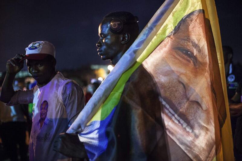 Supporters of the Congolese incumbent president celebrate in the streets of Brazzaville after information of an early lead in the electoral results spread through the city. Eduardo Soteras / AFP