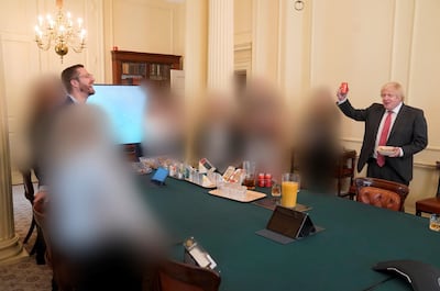 Boris Johnson, right, at a gathering in the Cabinet Room in 10 Downing Street on his birthday, which was released with the publication of Sue Gray's report. PA