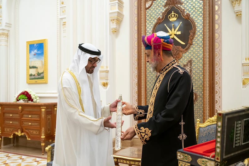 Sheikh Mohamed receives the gift of an Omani sword from Sultan Haitham. Mohamed Al Hammadi / UAE Presidential Court 
