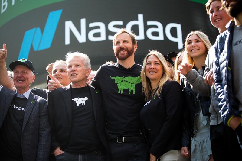 Ethan Brown, founder and chief executive officer of Beyond Meat Inc., center, stands for a photograph with guests during the company's initial public offering (IPO) at the Nasdaq MarketSite in New York, U.S., on Thursday, May 2, 2019. Beyond Meat Inc. more than doubled in its trading debut after raising $241 million in an upsized initial public offering that priced at the top of the marketed range. Photographer: Michael Nagle/Bloomberg