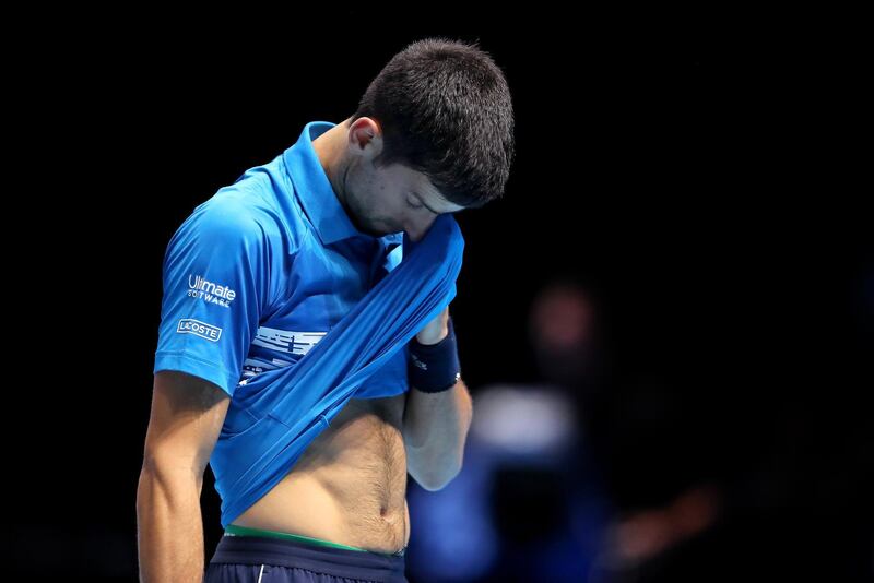Novak Djokovic of Serbia looks dejected in his final game. Last year's world No 1 was knocked out in the group stage after being beaten by Roger Federer. Getty