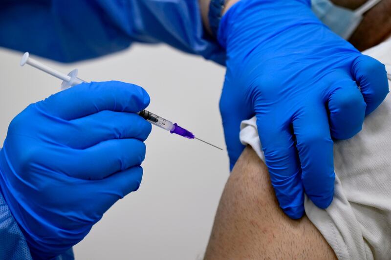 A health worker gets the Pfizer-BioNTech vaccine against the coronavirus disease at Rafik Hariri University Hospital in Beirut, Lebanon, on Sunday. EPA