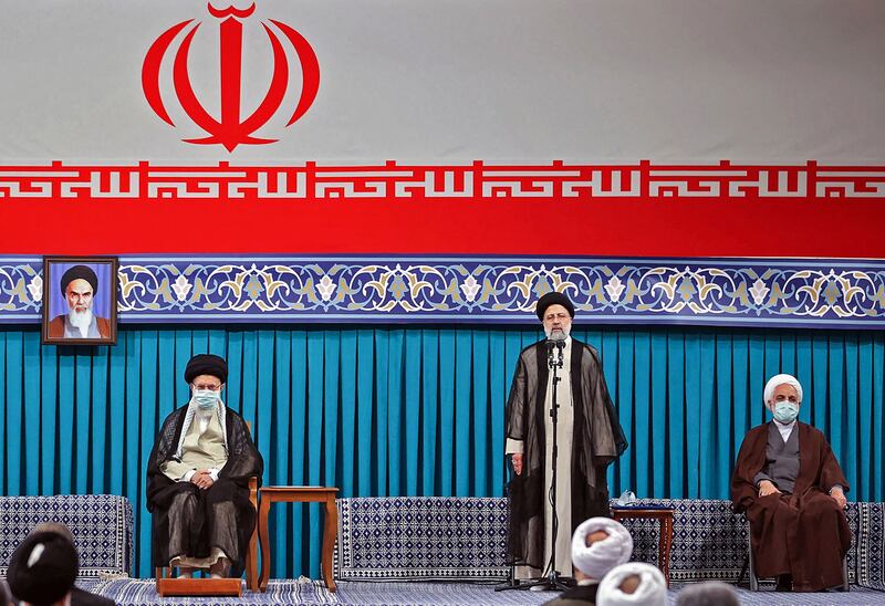 Iran's supreme leader Ayatollah Ali Khamenei, President-elect Ebrahim Raisi and judiciary head Gholamhossein Ejeii at a ceremony to certify the election results, on August 3.