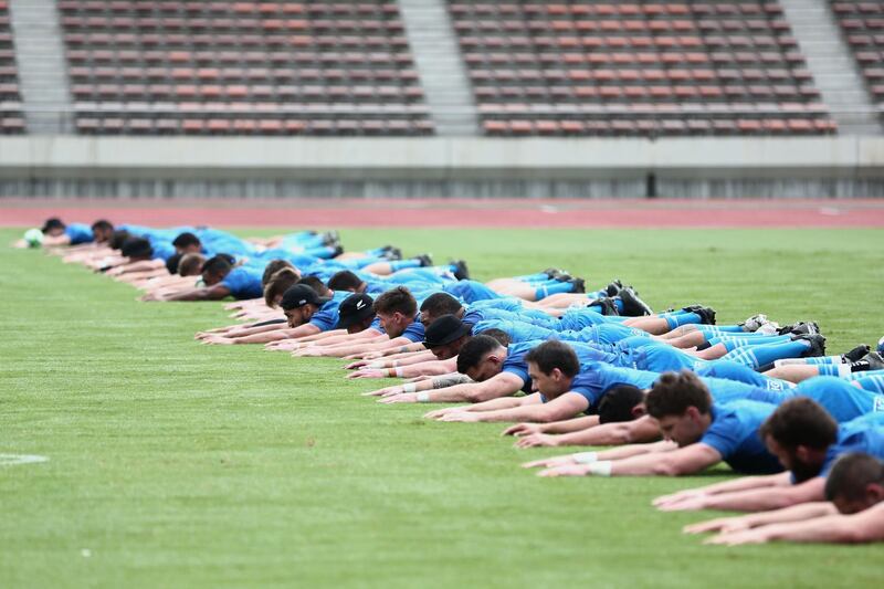 New Zealand players warming-up at Kashiwanoha Stadium. AFP