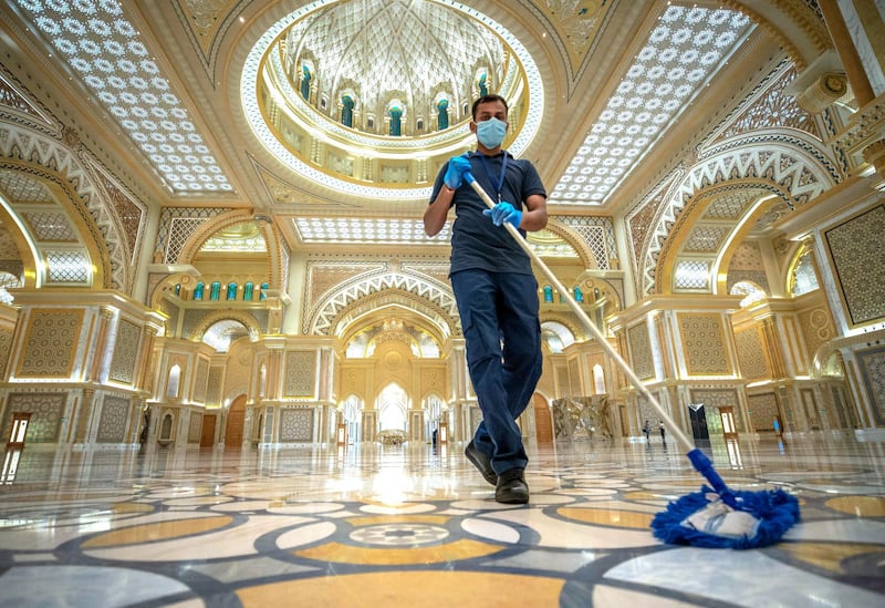Abu Dhabi, United Arab Emirates, October  20, 2020.   Qasr Al Watan reopens to public tours on Tuesday with strict measures in place to limit the spread of Covid-19.   Acleaner mops the floor.
Victor Besa/The National
Section:  NA
Reporter: