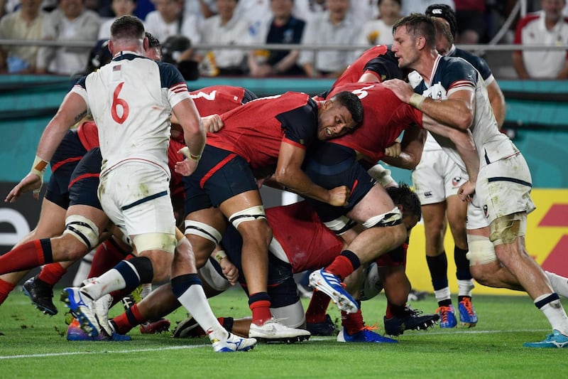England number 8 Billy Vunipola scores a try at the Kobe Misaki Stadium. AFP