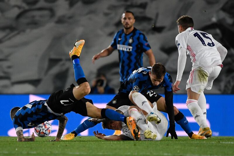 Inter Milan's Croatian midfielder Marcelo Brozovic and Real Madrid's German midfielder Toni Kroos fall down. AFP