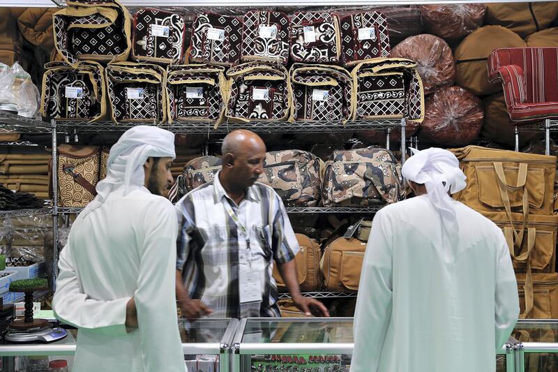 ABU DHABI , UNITED ARAB EMIRATES , SEP 12  ��� 2017 : - Visitors looking for different items on the first day of the ADIHEX 2017 held at  Abu Dhabi National Exhibition Centre in Abu Dhabi. ( Pawan Singh / The National ) Story by Anna