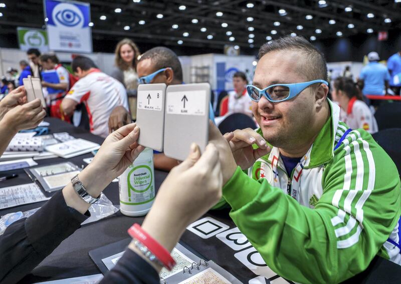 Abu Dhabi, March 17, 2019.  Special Olympics World Games Abu Dhabi 2019. At the Healthy Athletes area at ADNEC.  This is an area where the special athletes may get free medical check ups and enjoy other health activities. --Nacer Eddine Benali takes his color and Stereo test.
Victor Besa/The National