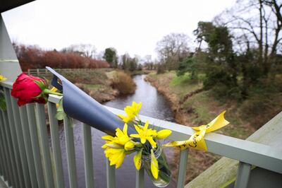 Tributes on a bridge over the River Wyre near where Nicola Bulley's bofy was found. Reuters.